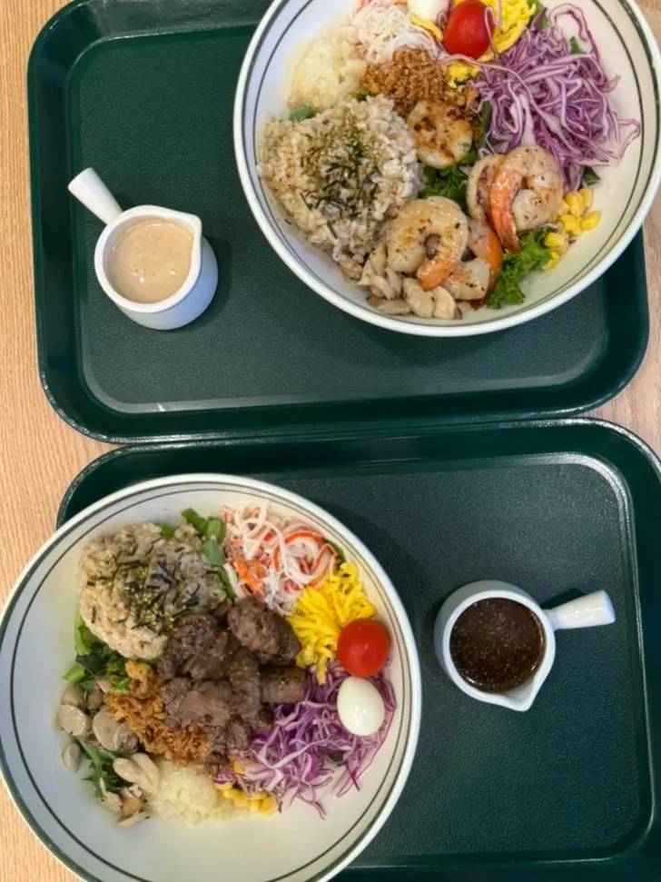 Two bowls of bibim poke served on the table