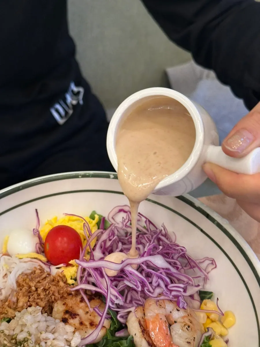 Poke drizzled with dark-colored wasabi mayo dressing