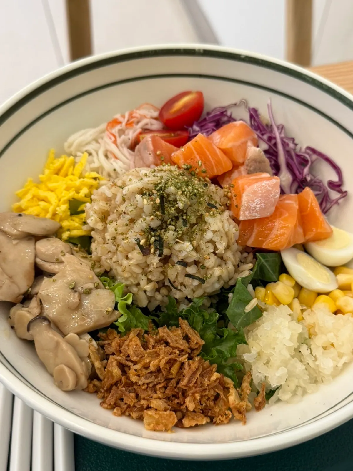 A bowl of real raw salmon poke with brown rice