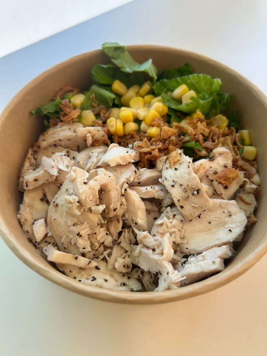 Close-up of grilled chicken thigh topping