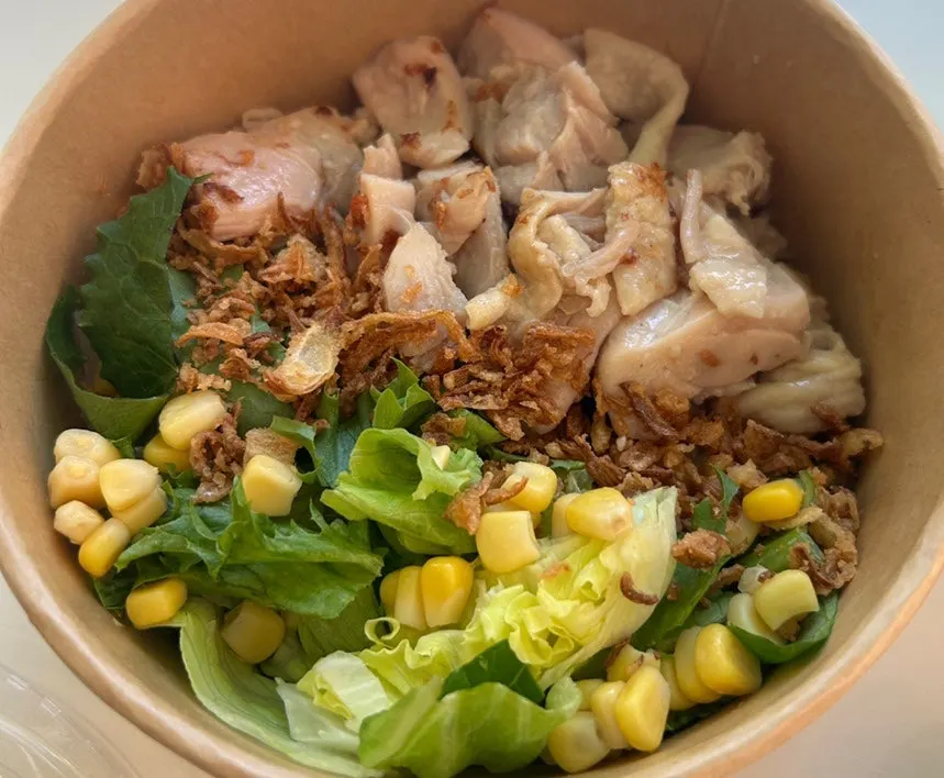 Brown rice, vegetables and signature sauce mixed together