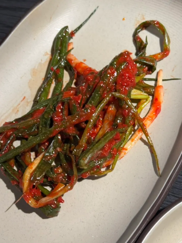 Green onion salad tossed in special sauce, and green onion kimchi