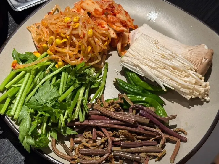 A plate of vegetables to go on the grill