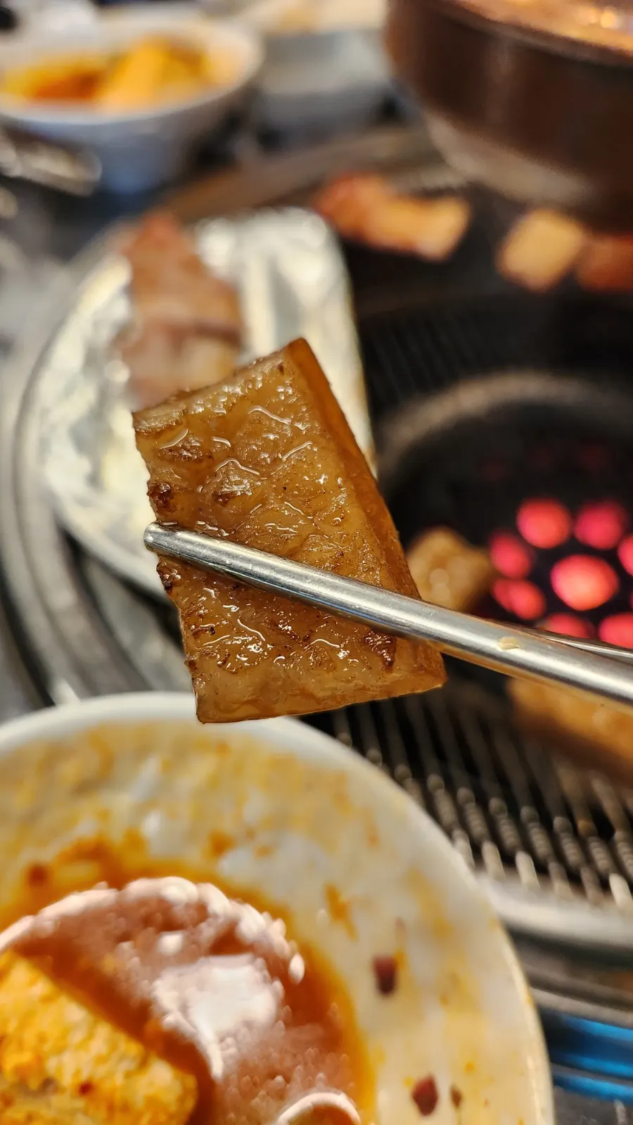 A piece of beehive pork skin dipped in soybean powder