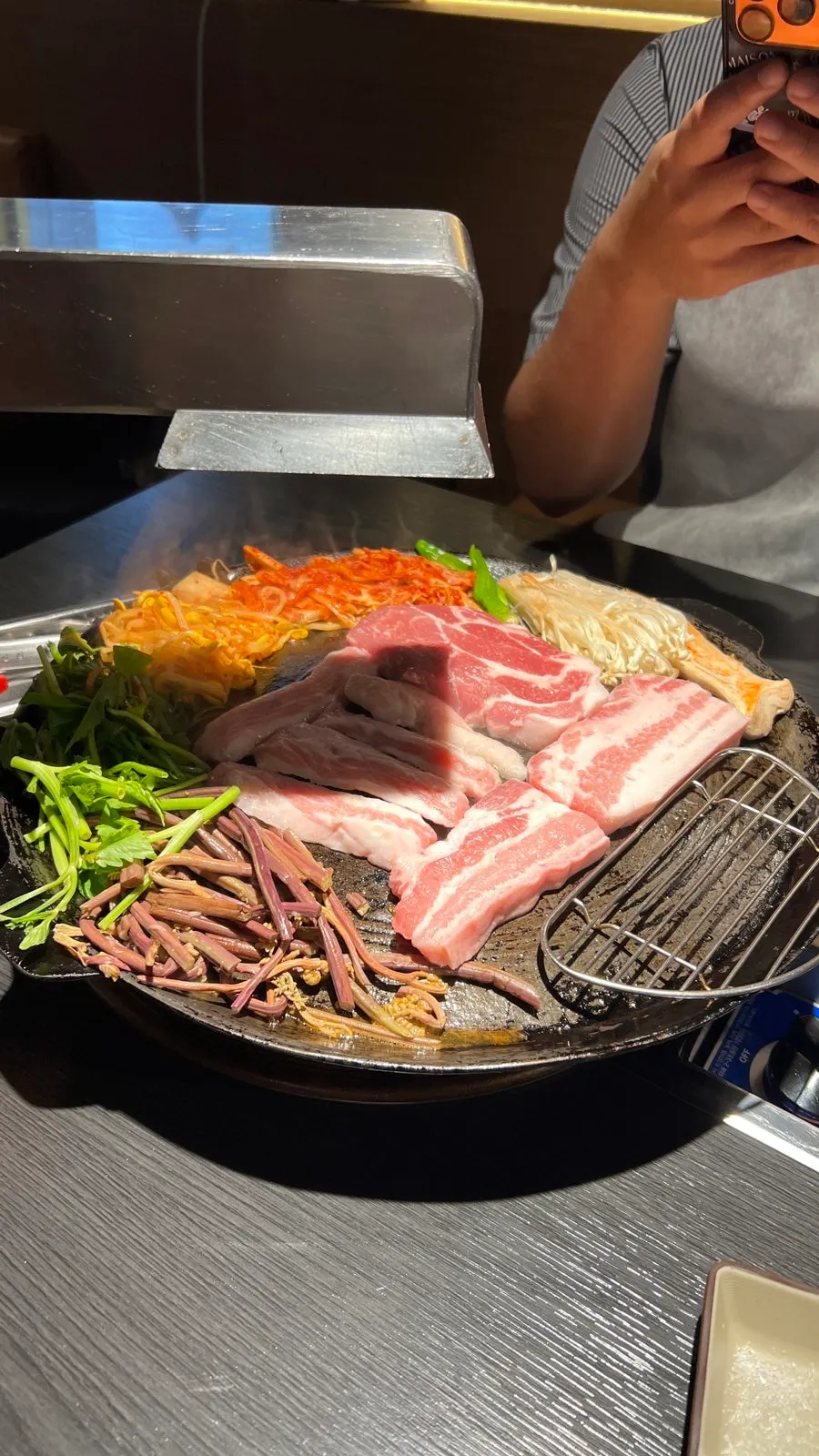 Kimchi, seasoned bean sprouts, and bracken fern grilling as side dishes