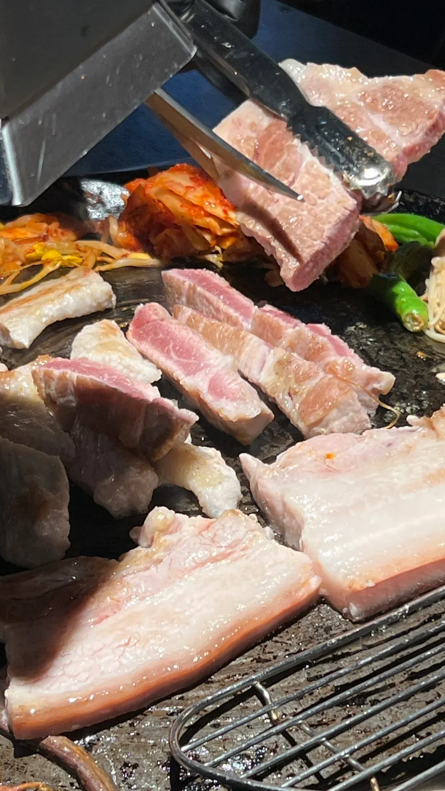 Golden-brown pork neck and vegetables cooking