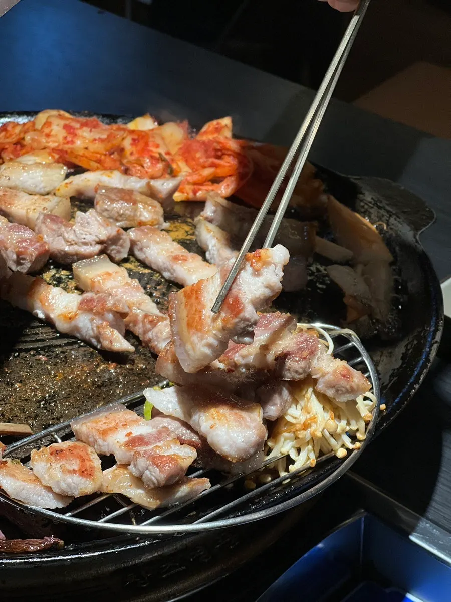 A piece of grilled pork belly with the skin still attached