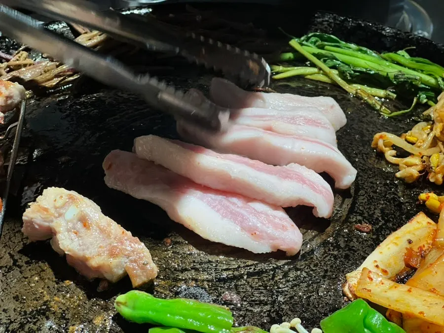 Kimchi cooked in meat fat paired with pork