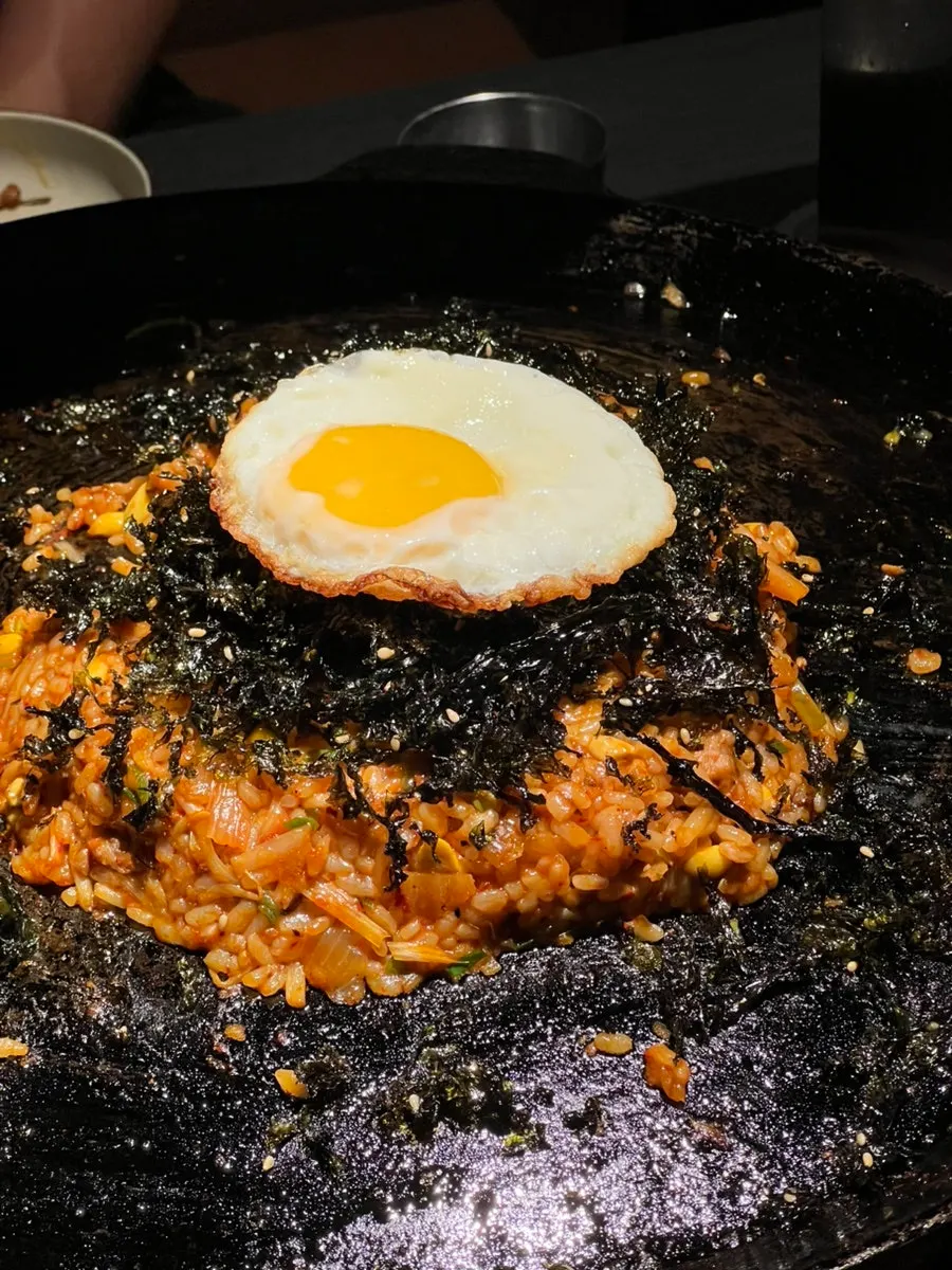 Cauldron lid completely scraped clean of fried rice