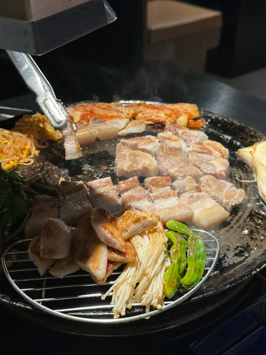 Cauldron-lid pork belly turning golden brown