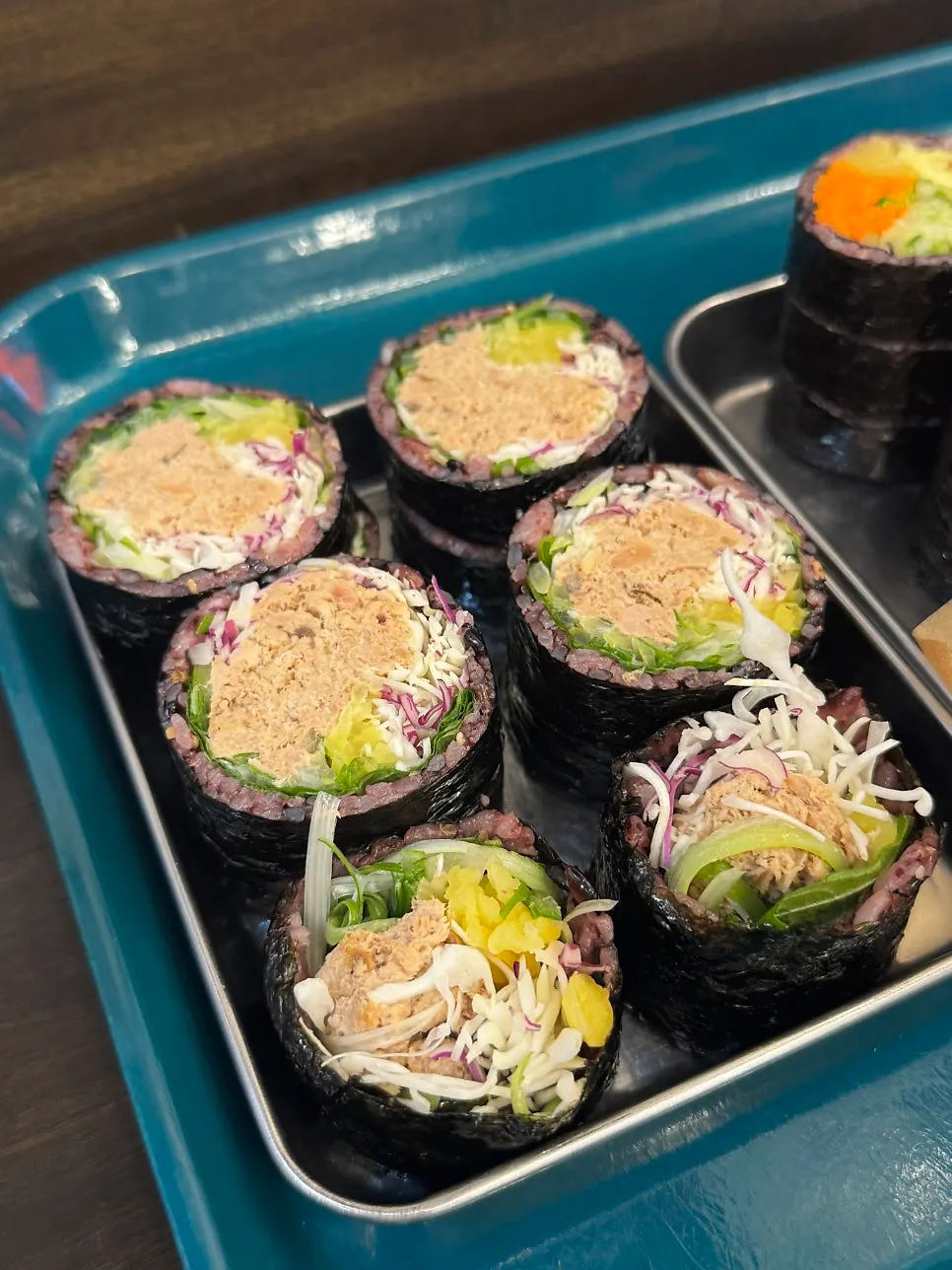 Gimbap and dakgangjeong spread at Halls Gimbap Main Branch near Gyodae Station