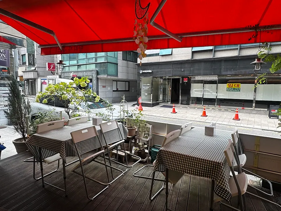 Outdoor terrace seating at the entrance of Halls Gimbap Main Branch