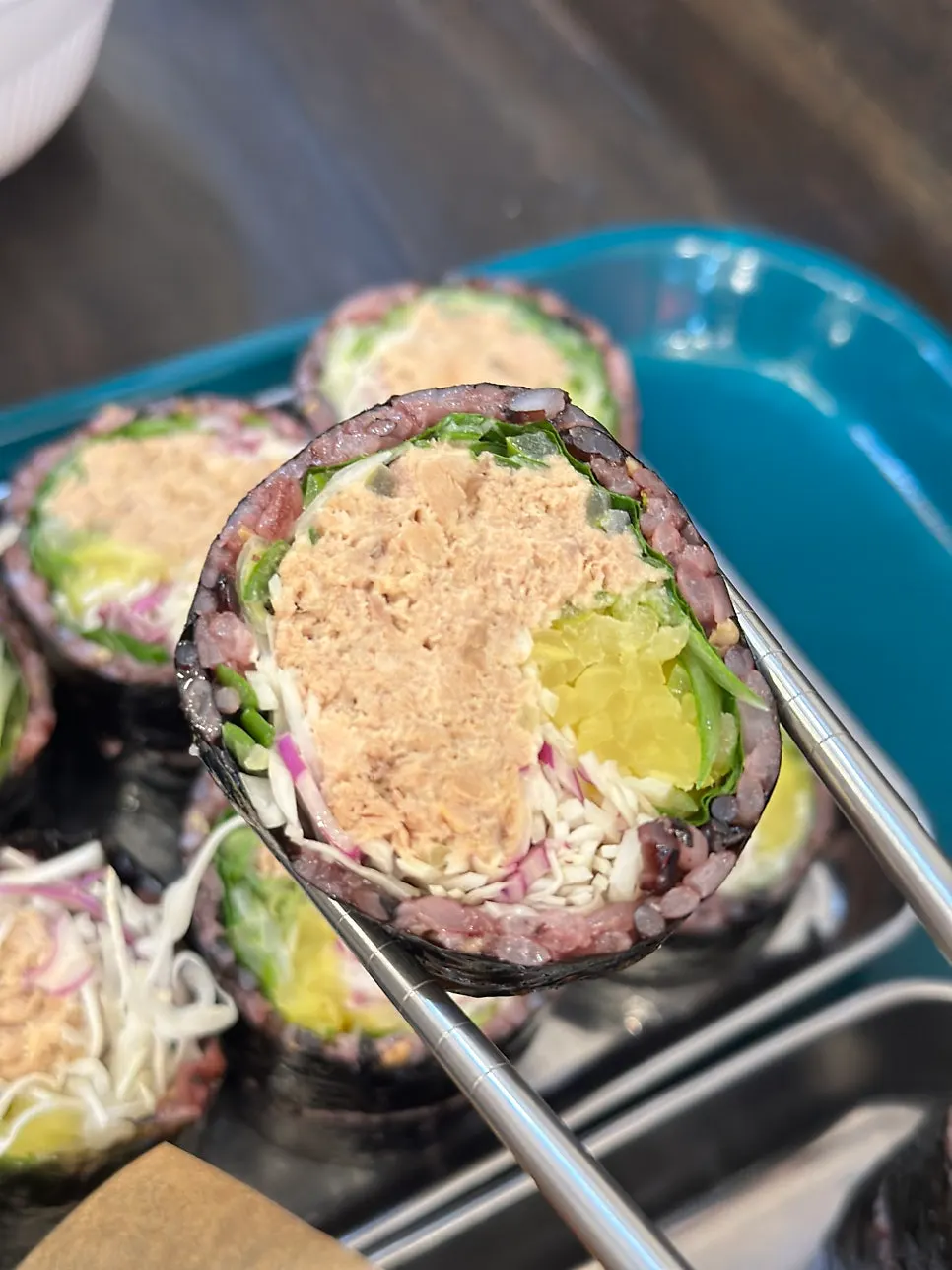 Cross-section of Jindo green onion tuna gimbap packed with tuna