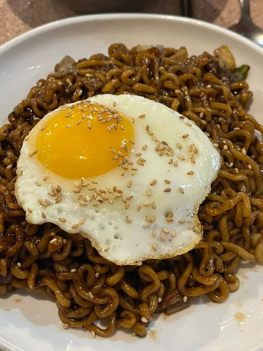 Kimchi and beansprouts grilled together on the pan