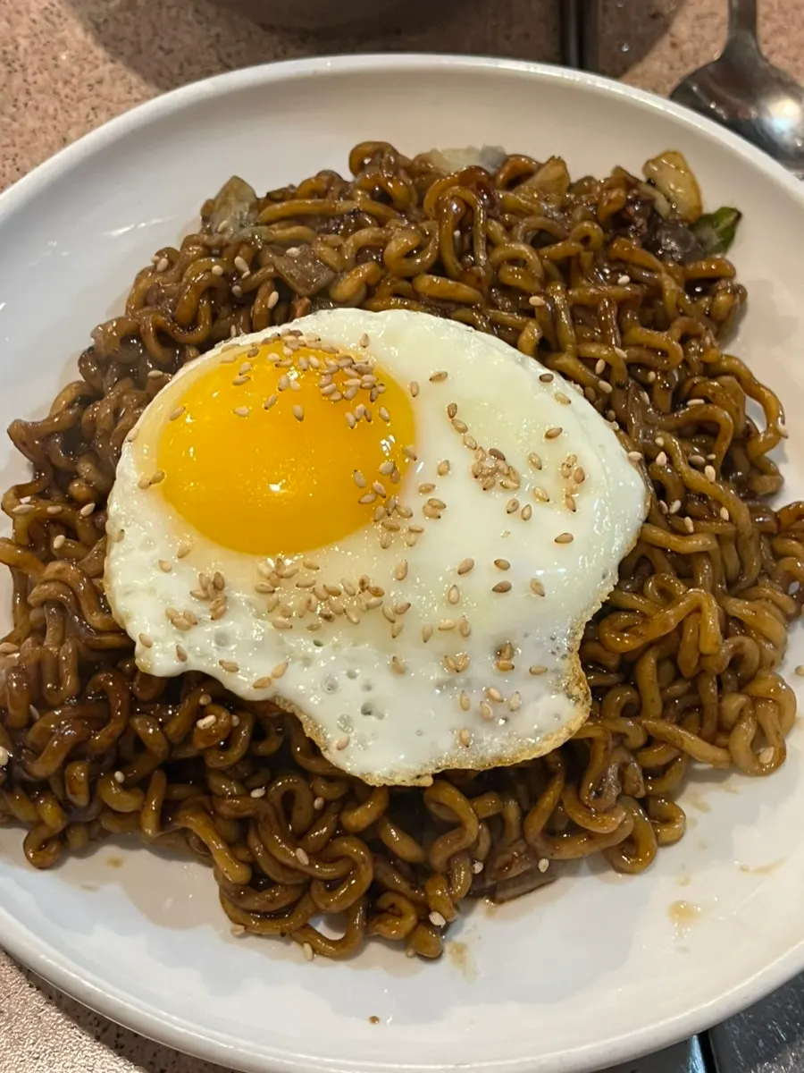 Truffle jjagyeti (egg soup) topped with egg yolk