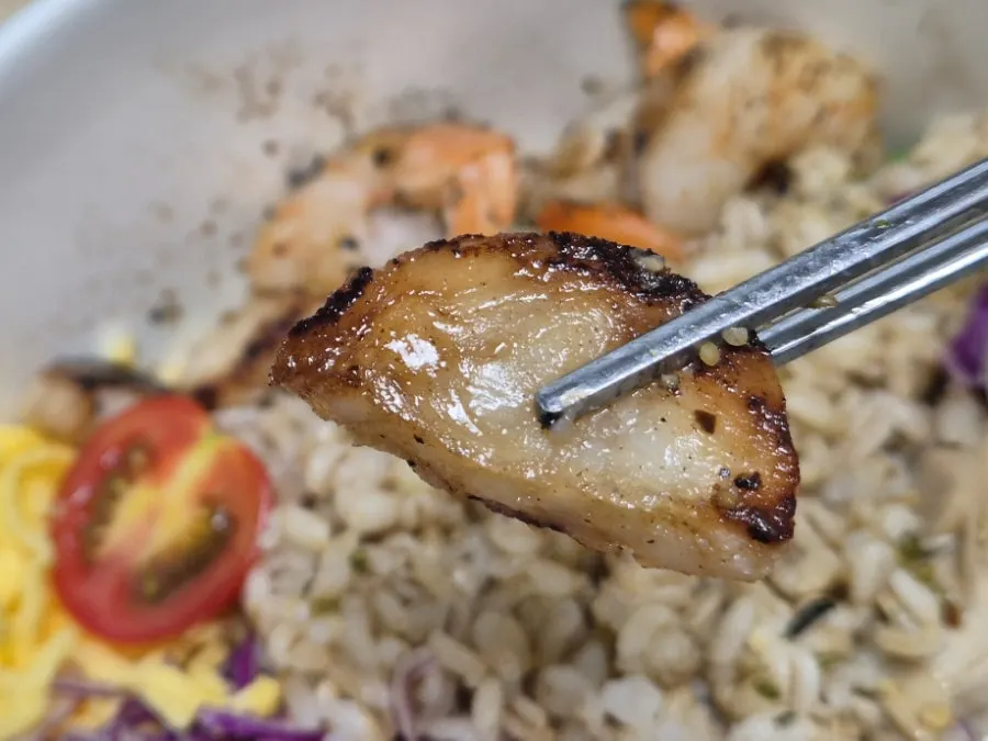 Close-up of golden-charred shrimp topping