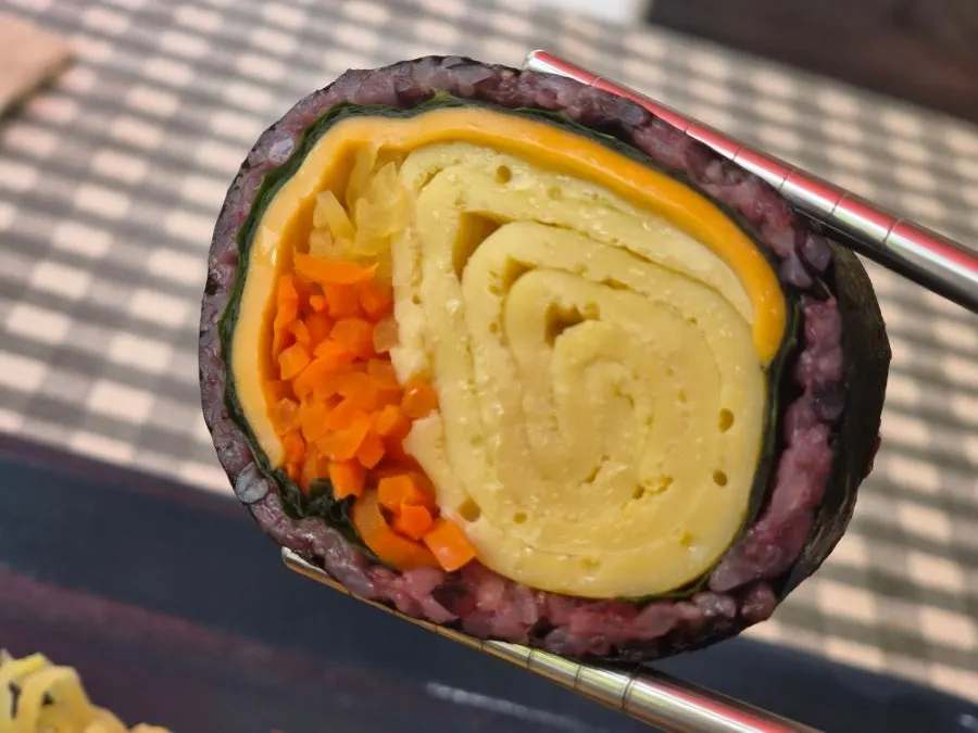 Gimbap with visible fillings and crispy chicken
