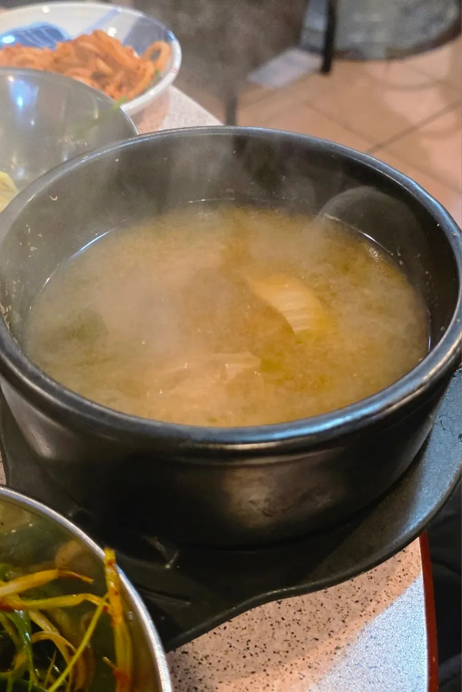 A grill full of grilled kimchi and bean sprouts