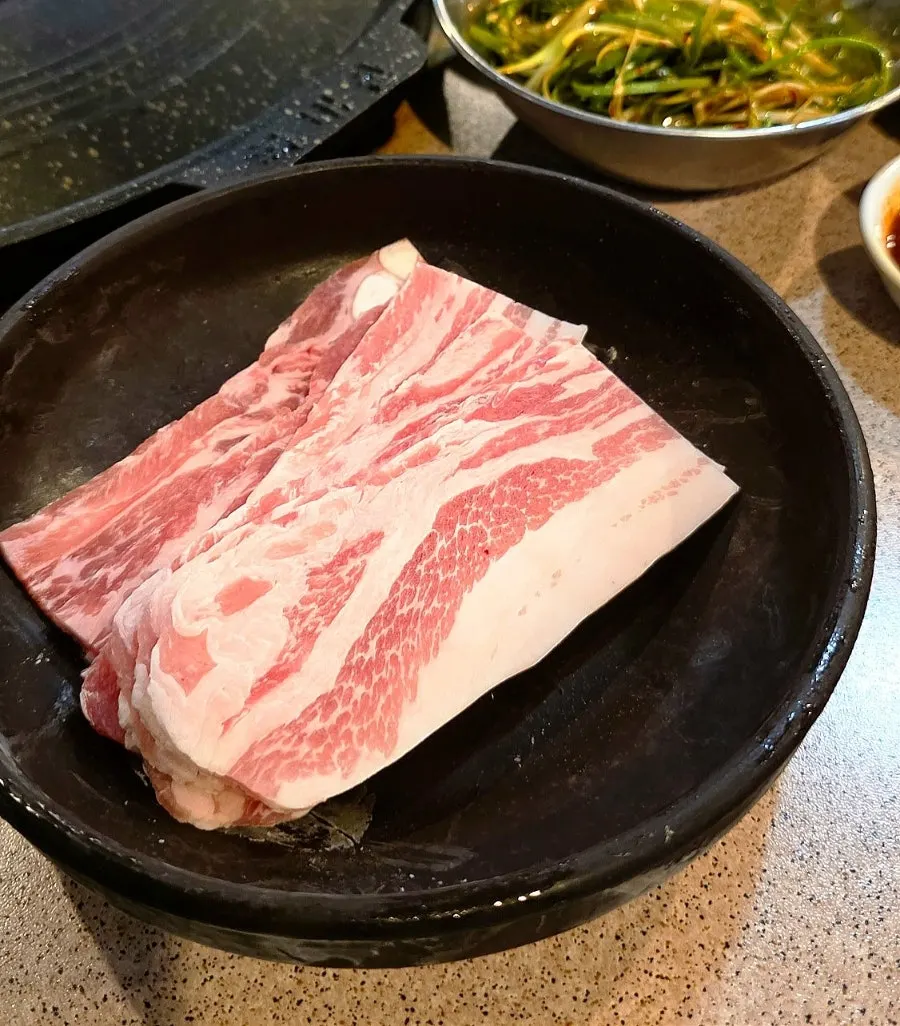 Fresh pork belly, fresh pork neck, and thin-sliced pork belly arrangement