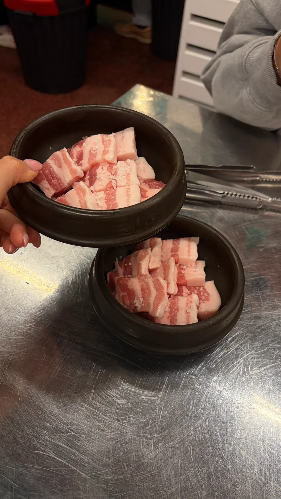 Close-up of earthenware-aged coarse-salt pork belly