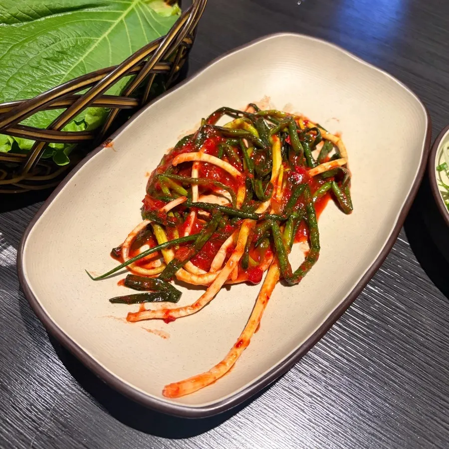Green onion kimchi, pickled scallions, and garlic side dishes