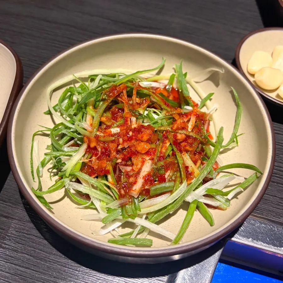 Rice in a brass bowl with macaroni salad side dish
