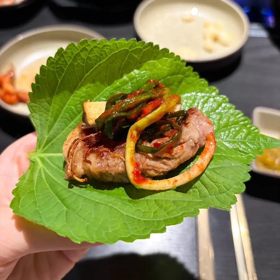 Perilla leaf wrap with pickled scallions and mushrooms