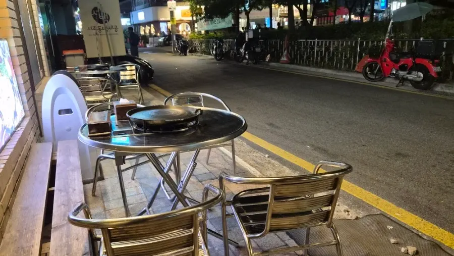 Outdoor terrace seating in front of Gyodaepae