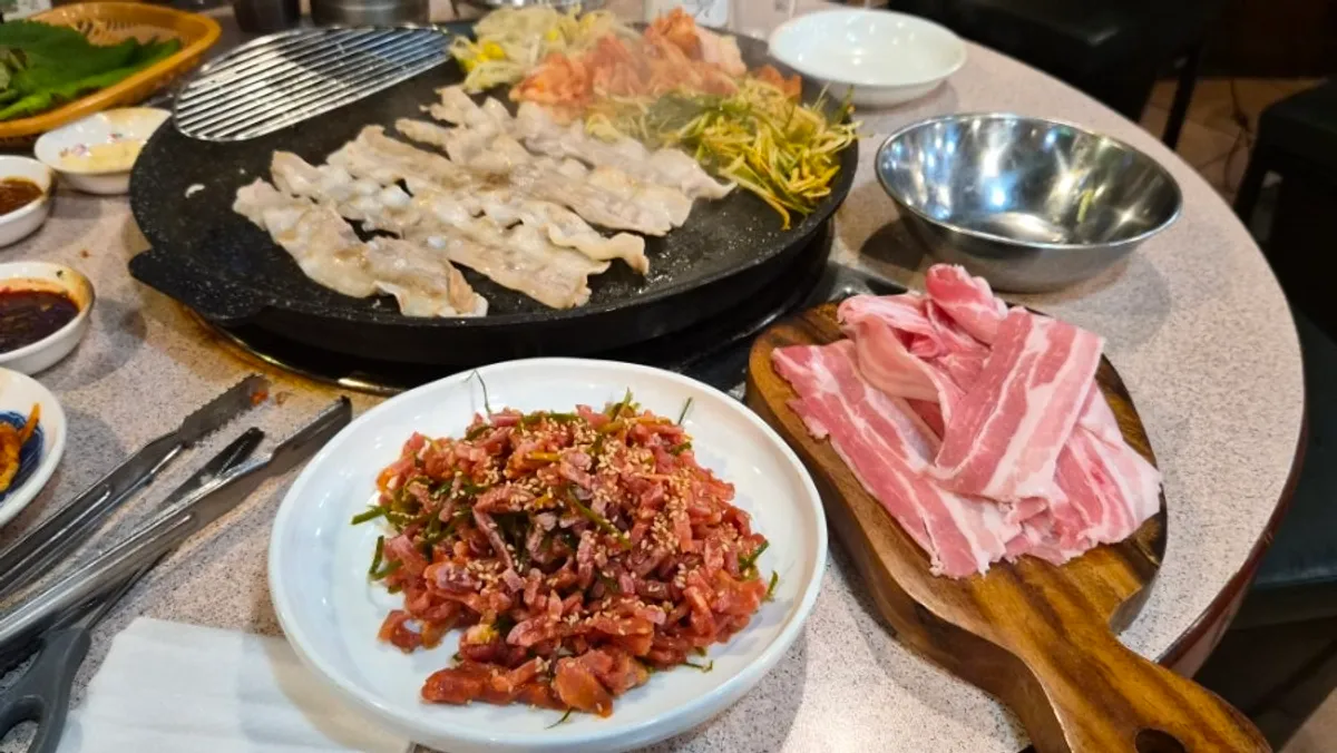 A plate of rosy chilled fresh pork belly