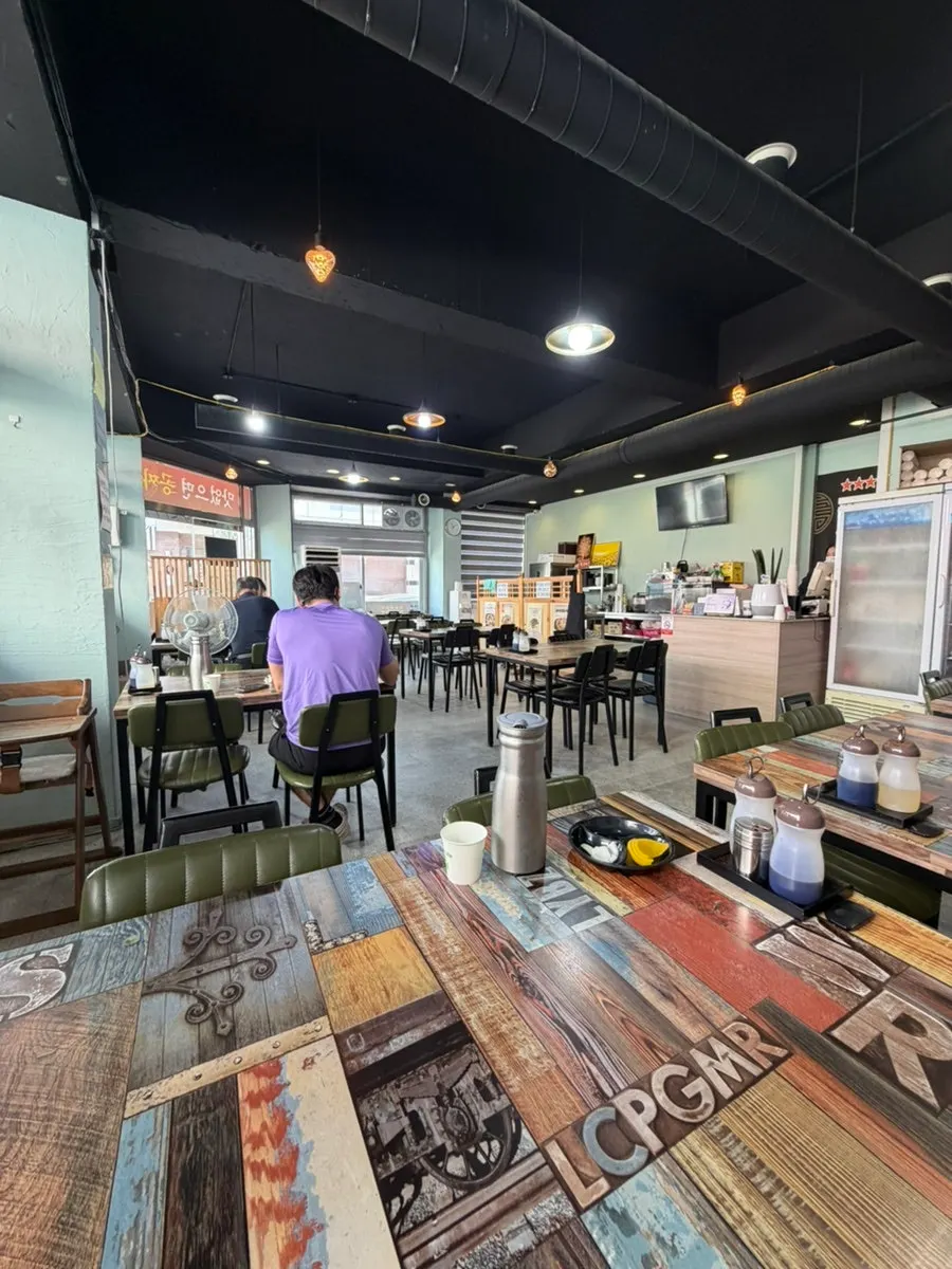 Interior of Gyodong Jjamppong Yongjeong Branch with spaced-out tables