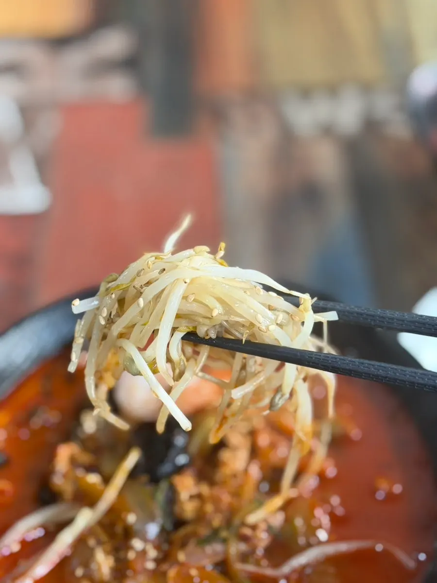 Shrimp and seafood scooped up from the jjamppong