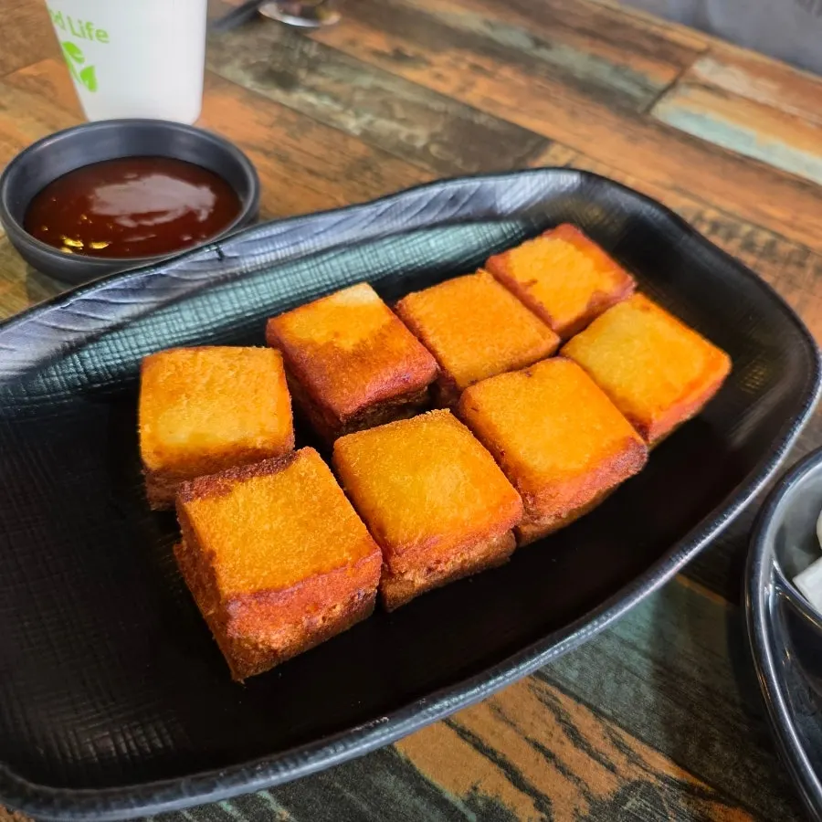 A plate of golden fried menbosha