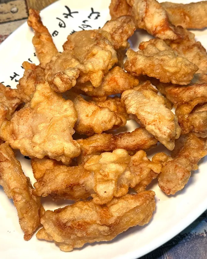 A piece of mini glutinous tangsuyuk at Gyodong Jjamppong Yongjeong Branch