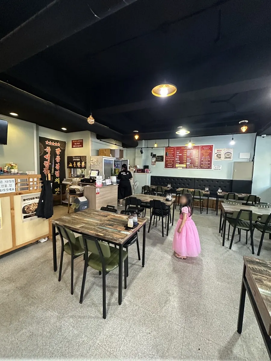 Spacious dining hall with tables at Gyodong Jjamppong Yongjeong Branch