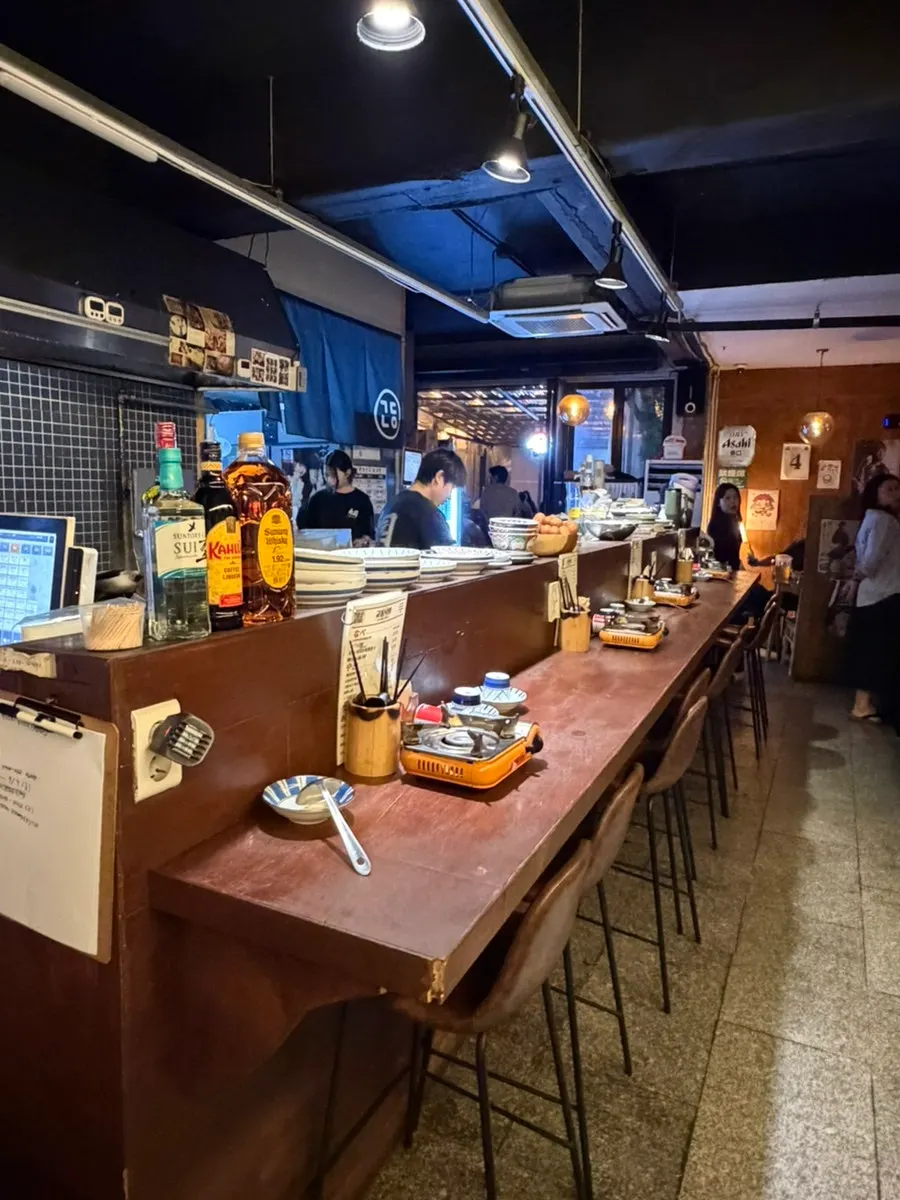 Bar-style seats in front of the kitchen at Gyodong Nakwon