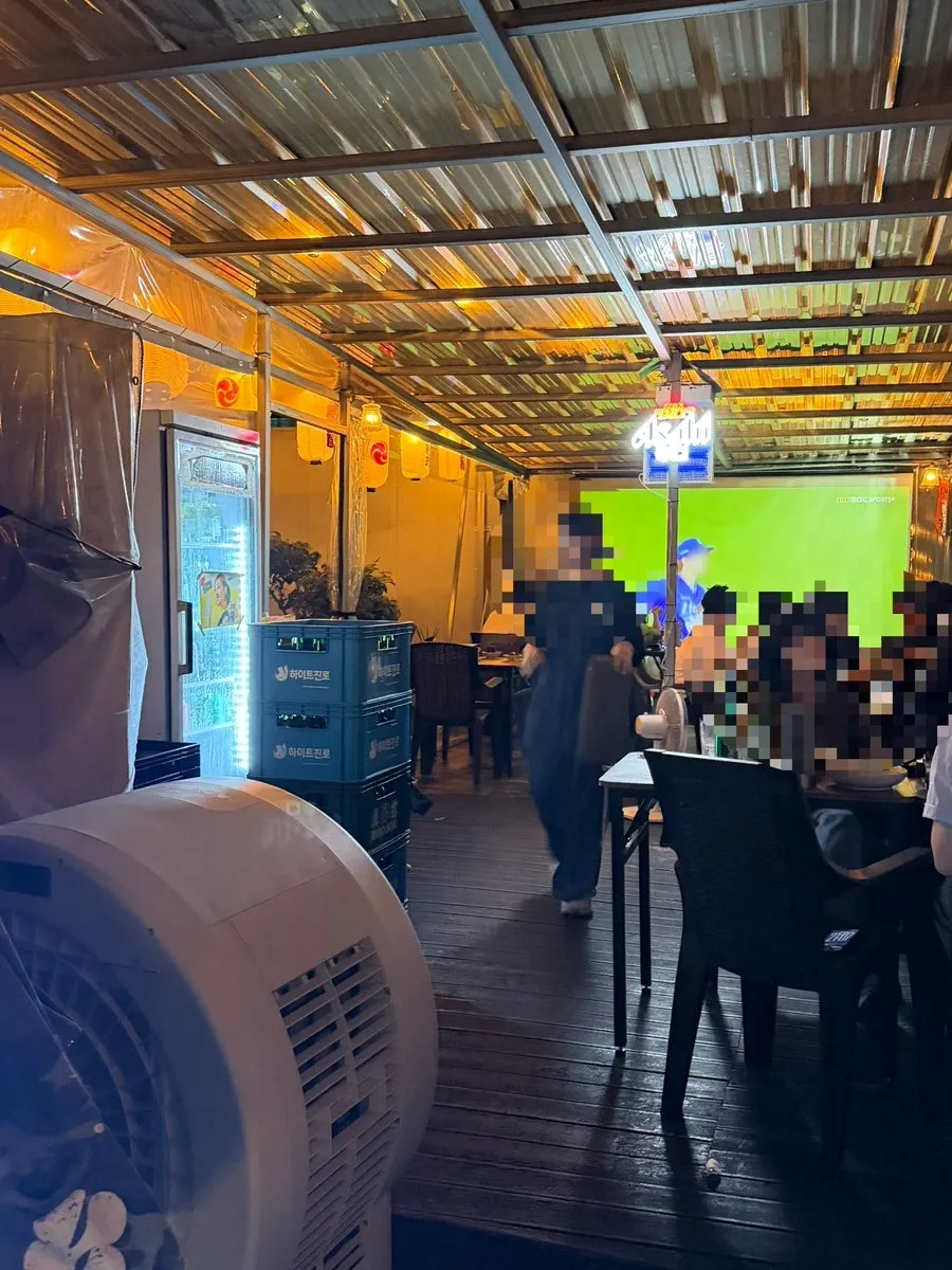 The back room at Gyodong Nakwon with a large screen installed