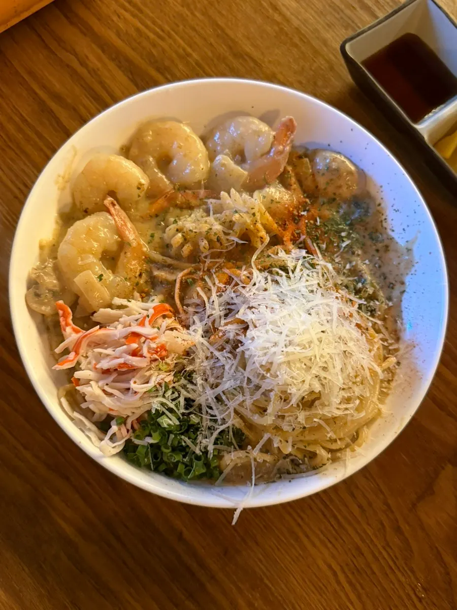 Gyodong Nakwon's crab tomalley pasta topped with whole shrimp
