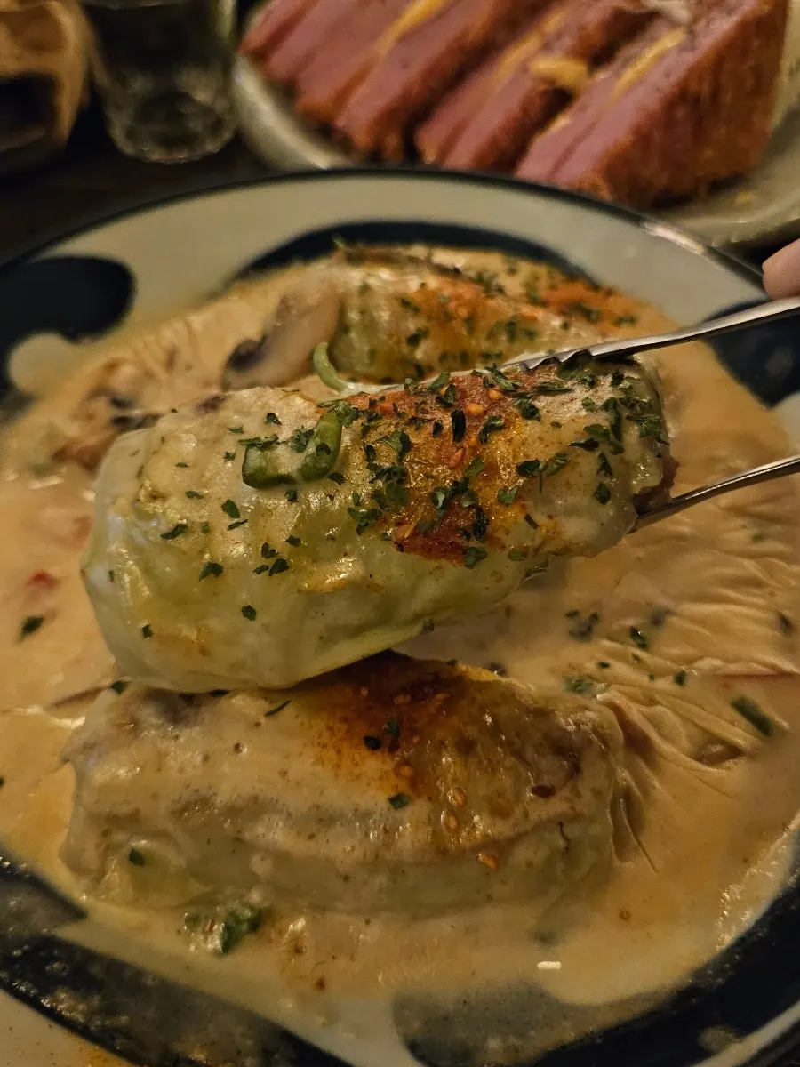 A cut piece of cabbage roll lifted up