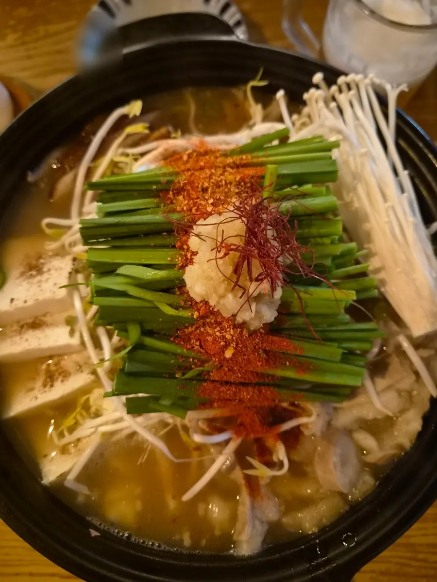 Pot of motsunabe beef intestine hot pot before boiling