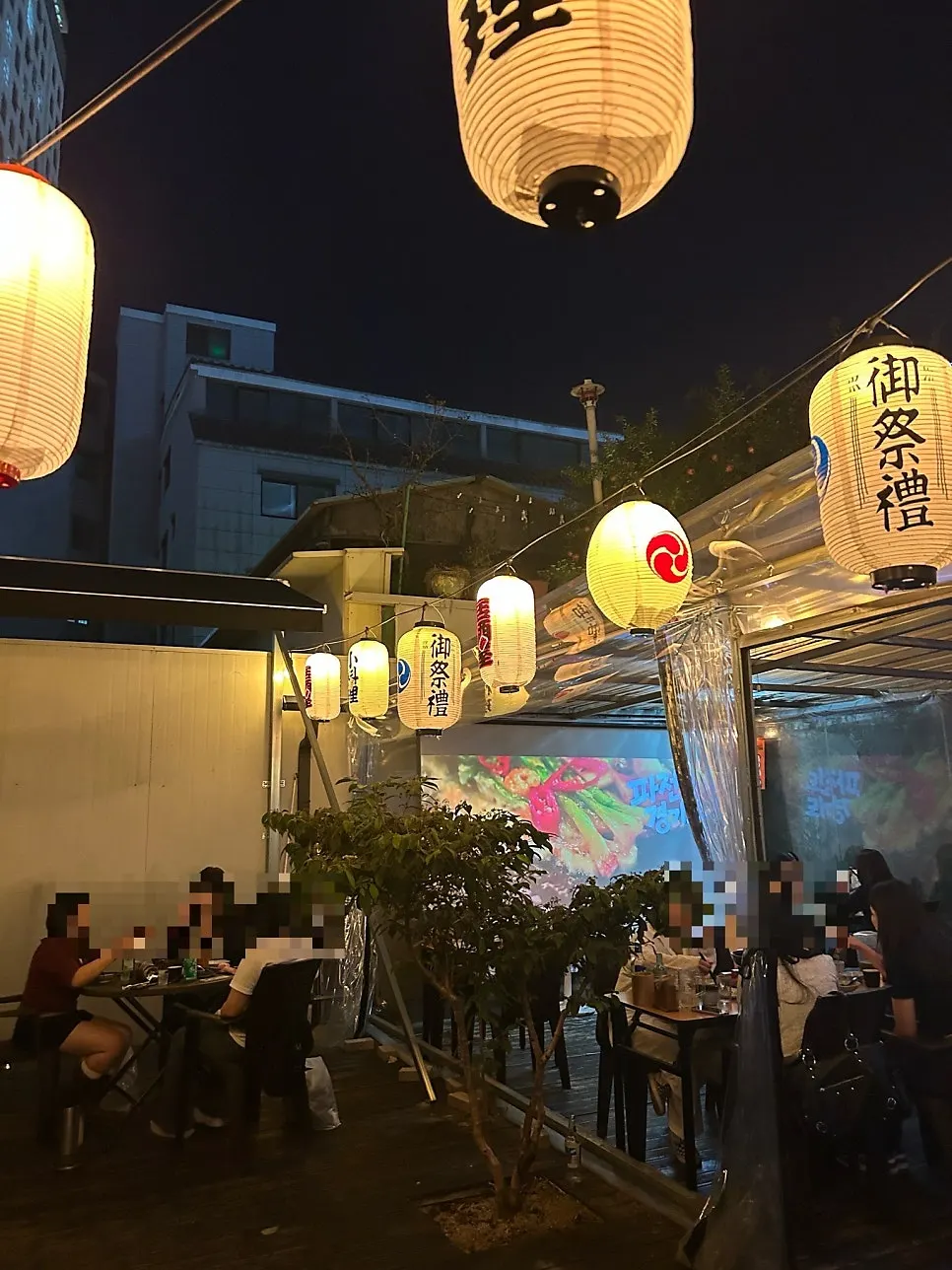 Night view of the outdoor terrace at Gyodong Nakwon, a Daegu izakaya