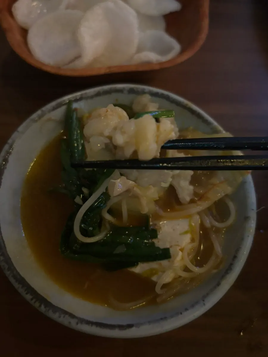 Chicken-broth-based motsunabe soup