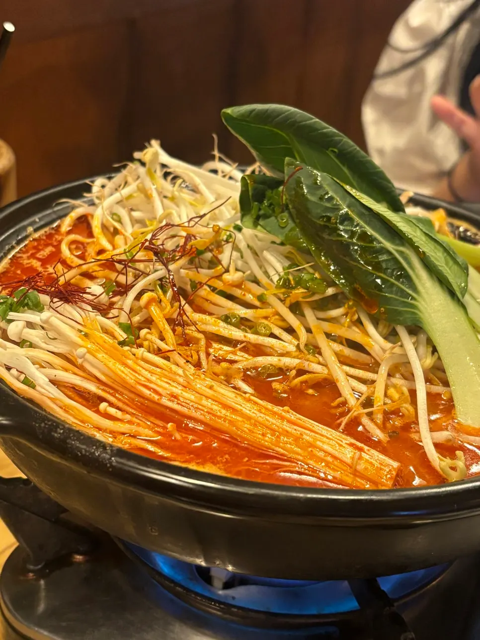 Spicy Osaka beef brisket jjamppong topped with bean sprouts and vegetables