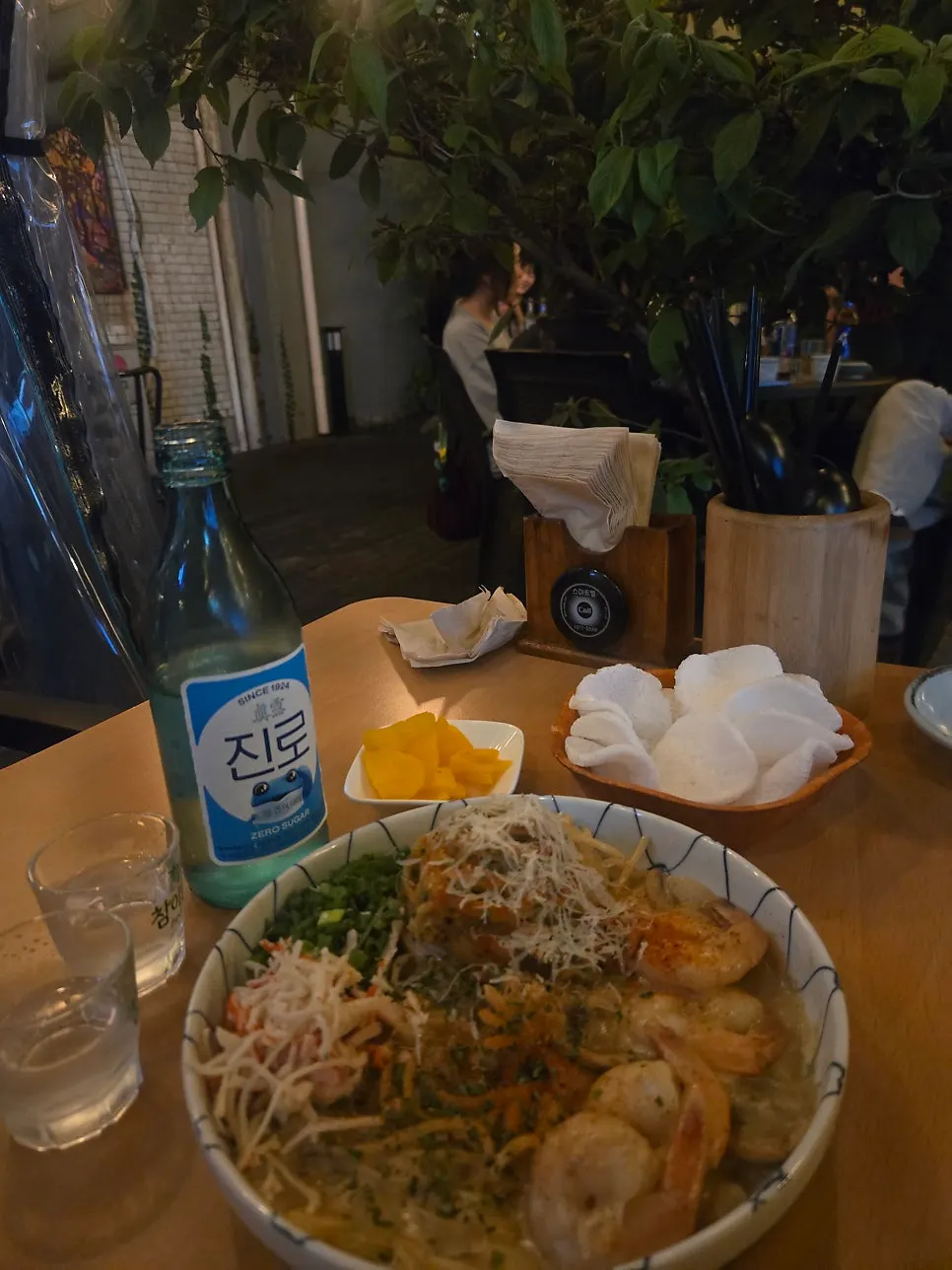 Noodles from the crab tomalley pasta topped with cocktail shrimp