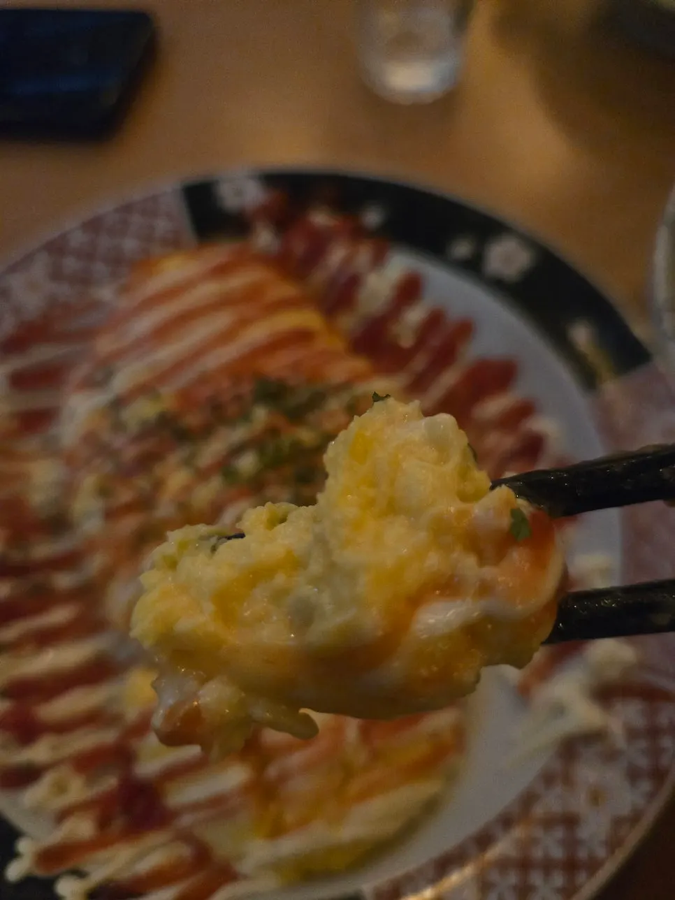 Cheese omelet split open with melted cheese spilling out