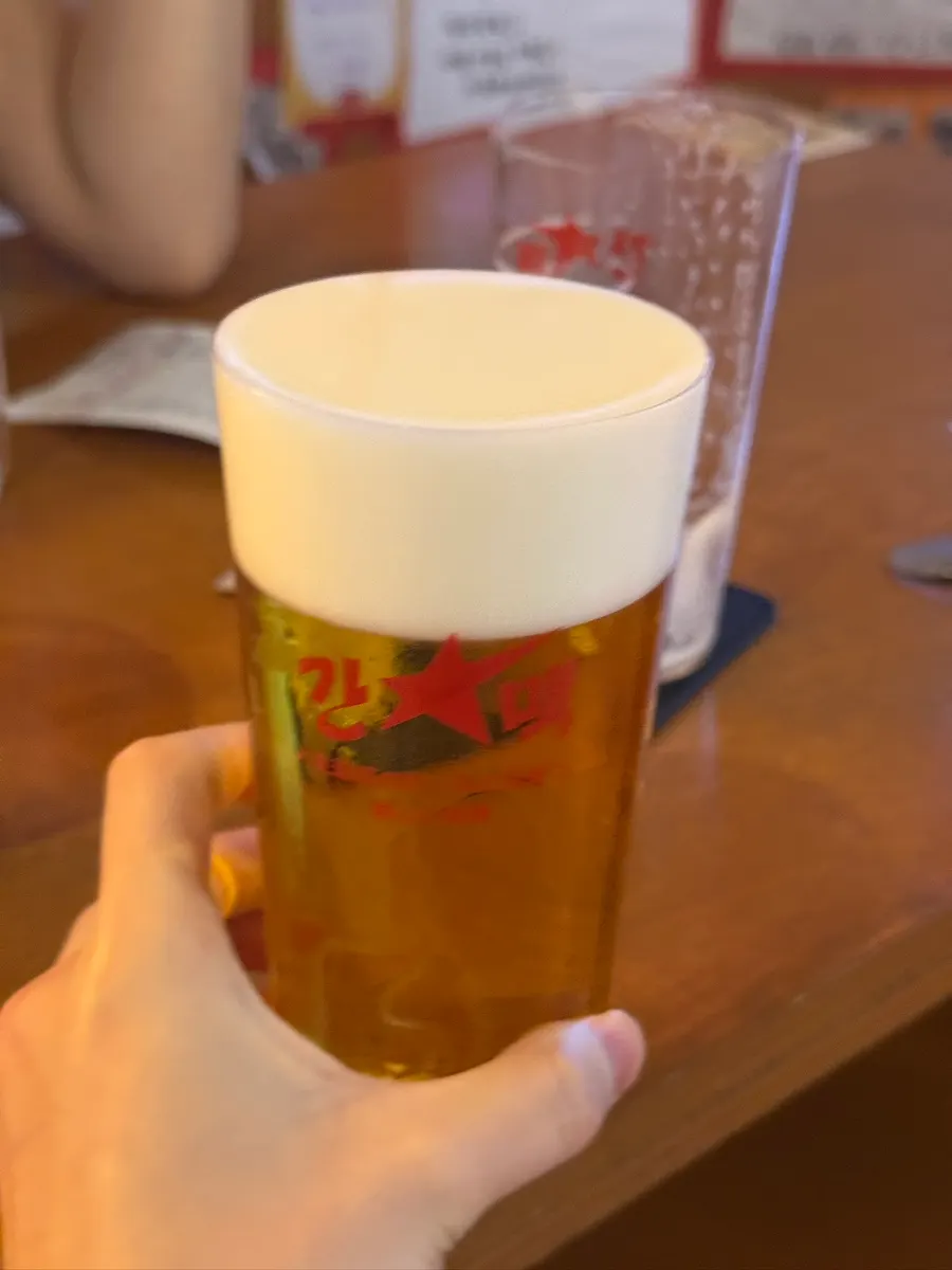 Tebasaki, gyoza, and beer together