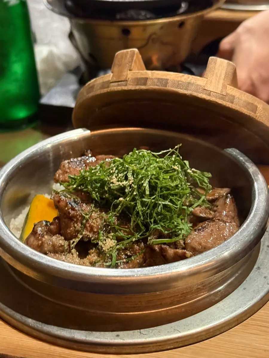Niku mabushi topped with beef, pumpkin, and perilla leaf