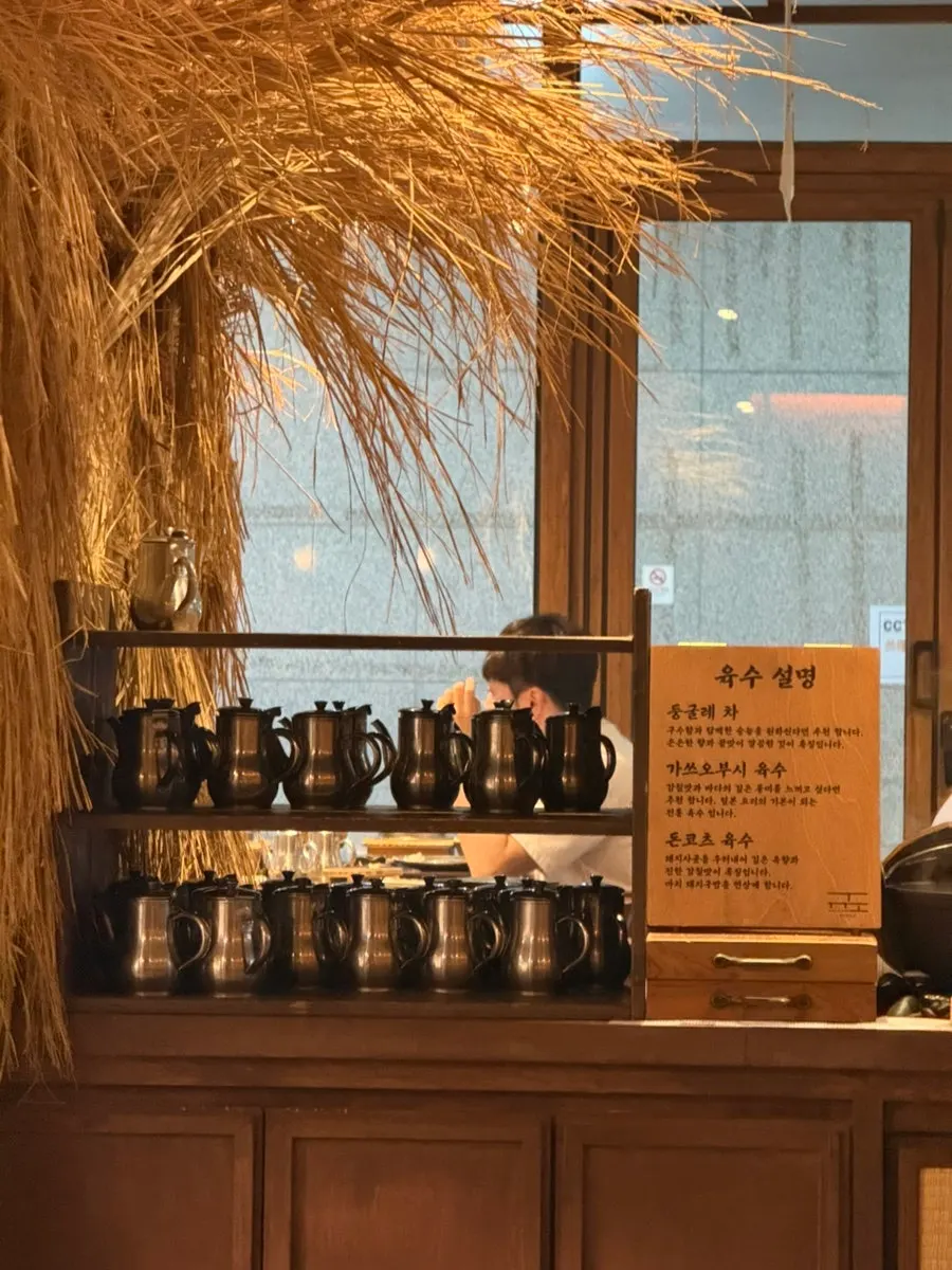 Broth options and pot rice refill corner at the self-bar
