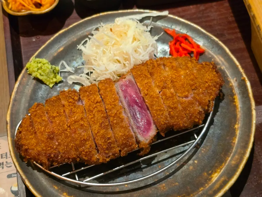Cross-section of gyukatsu showing thin breading and thick meat