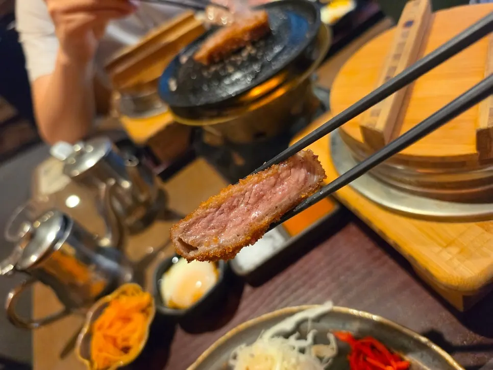 A piece of smoked gyukatsu tasted with no seasoning