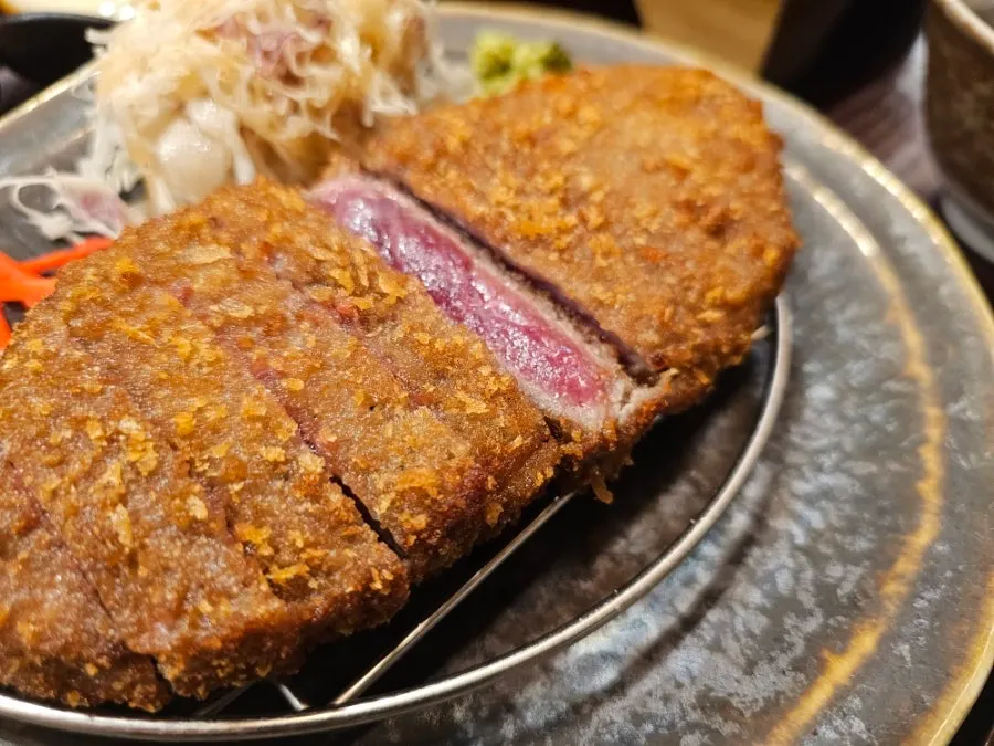 Cross-section of the smoked gyukatsu showing the crispy-outside, juicy-inside texture